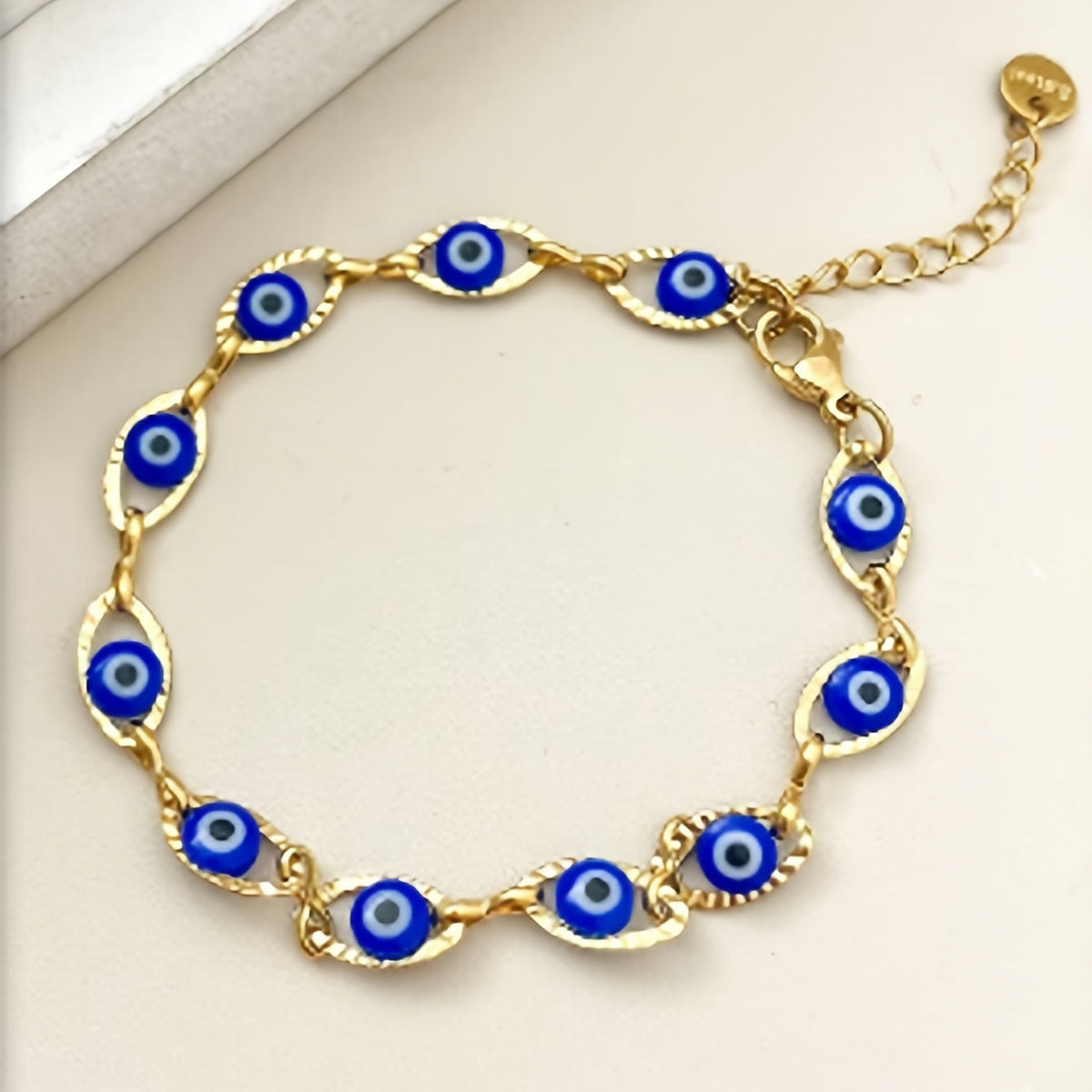 Minimalistische vergulde tennisarmband met boze oog