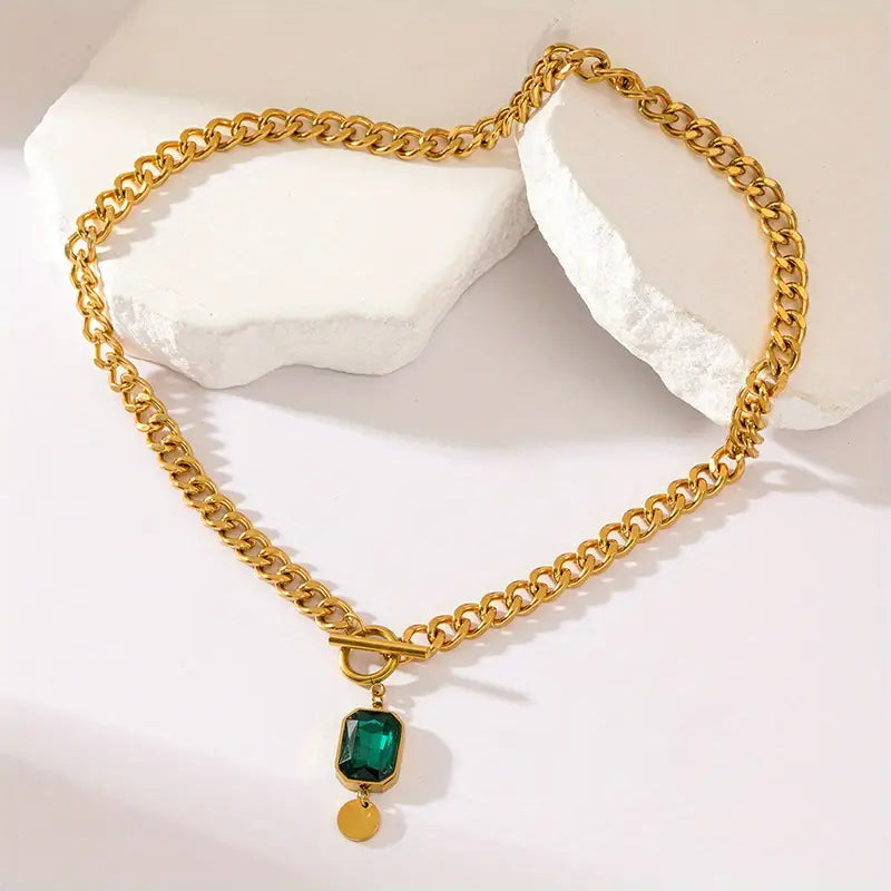 Chunky schakelketting met smaragd hanger | goudkleurig