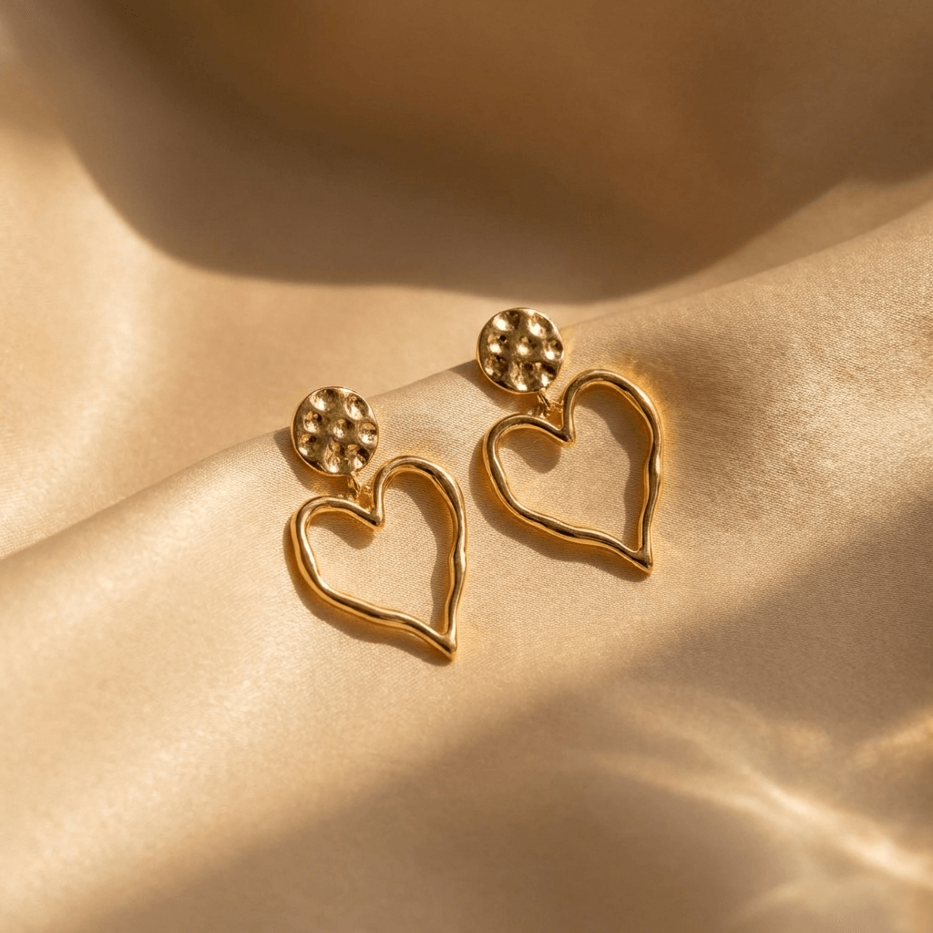 Elegante vergulde oorhangers met open hart