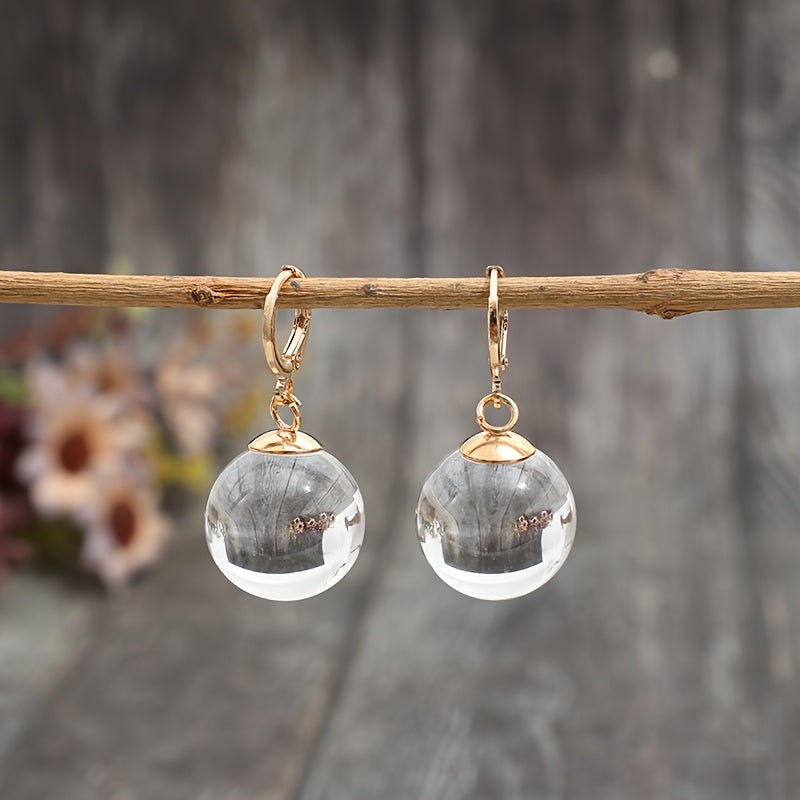 Minimalistische oorhangers met ronde glazen hanger
