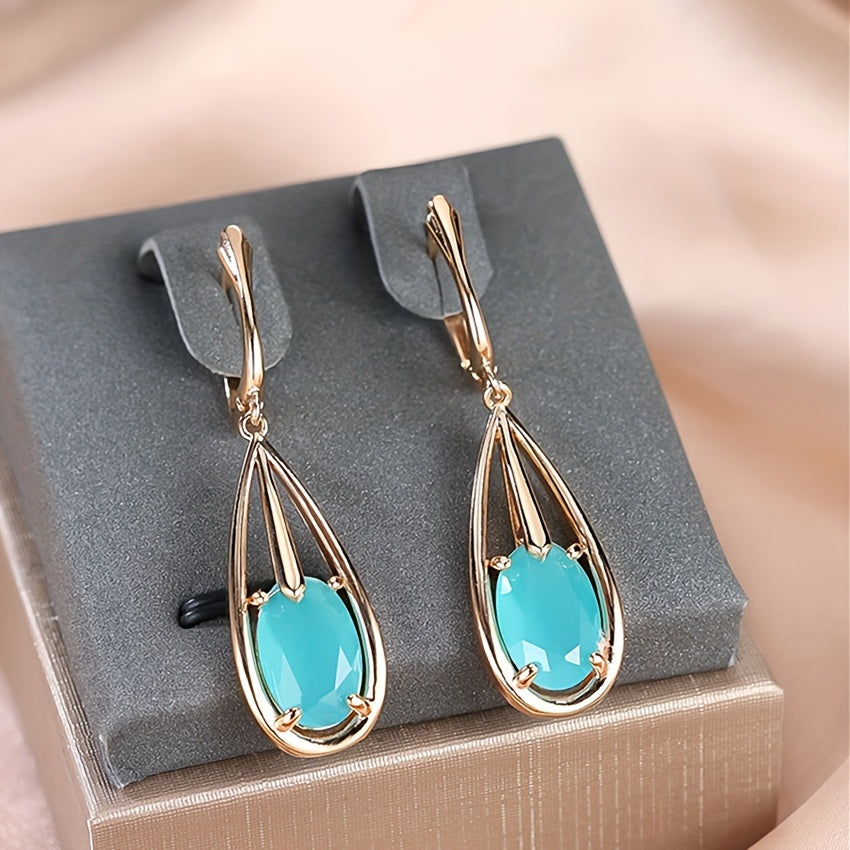 Elegante vergulde lange oorhangers met druppelvormige zirkonia