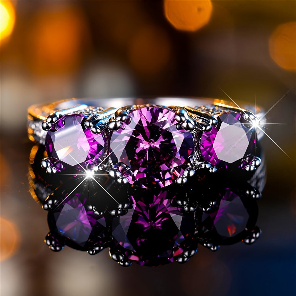 Vintage ring met drie ronde paarse zirkonia's
