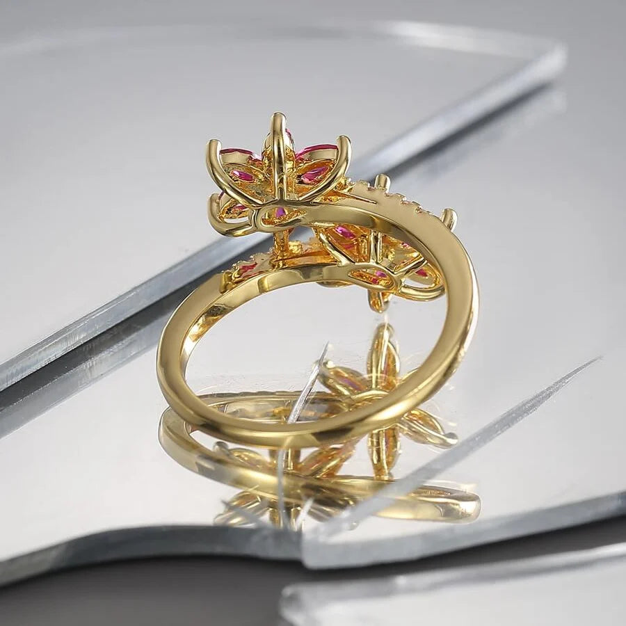 Elegante vintage wikkelring met zirkonia en robijnen bloem
