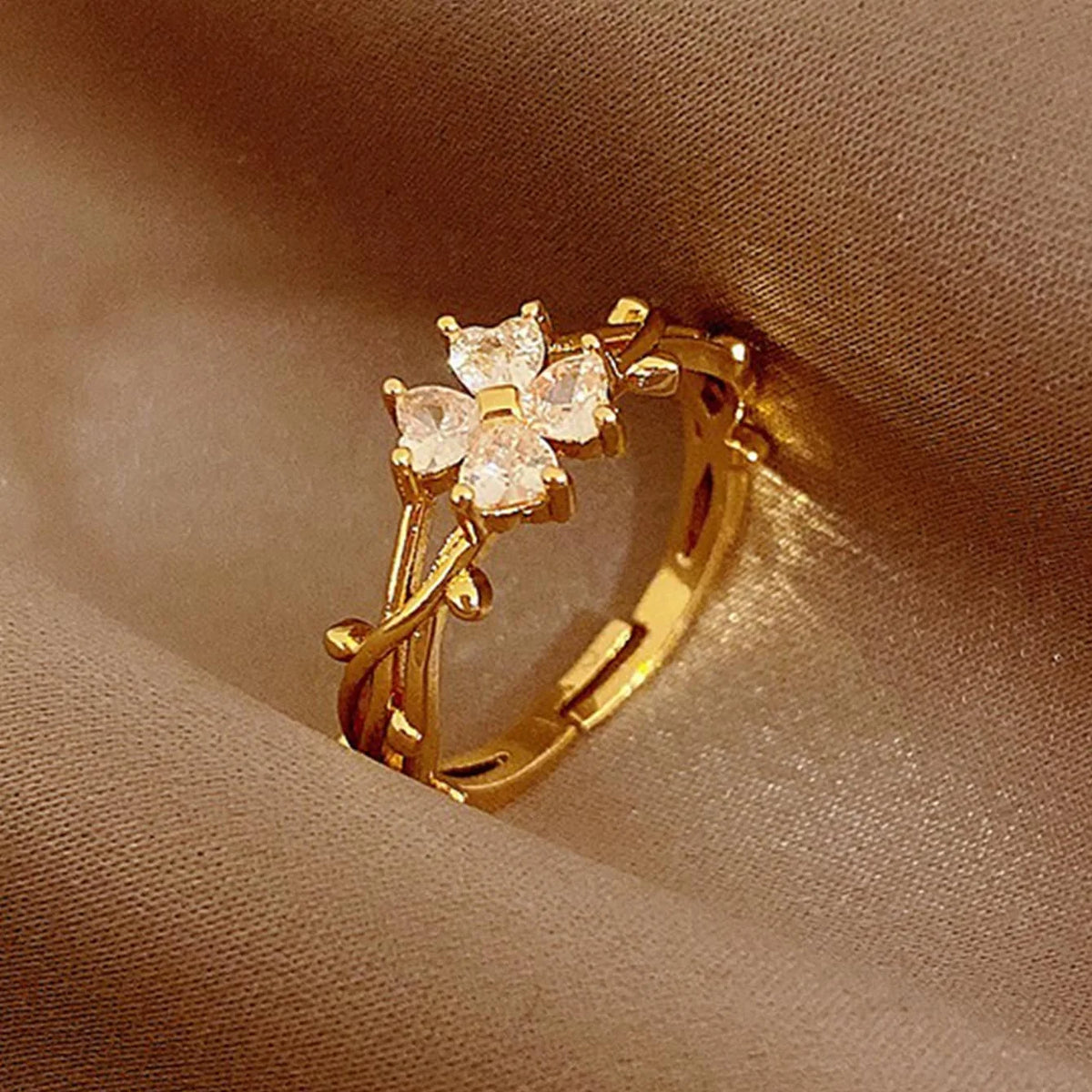 Elegante verstelbare open ring met zirkonia bloem en blad