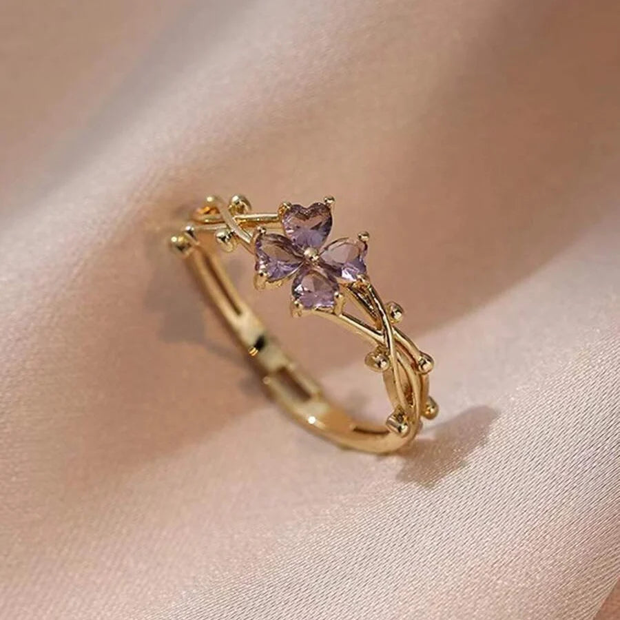 Elegante paarse open ring met klavertjevier en zirkonia