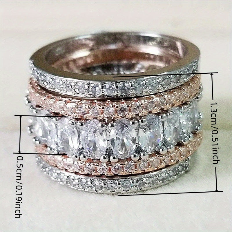 Elegante tweekleurige ring met brede band en glanzende zirkonia
