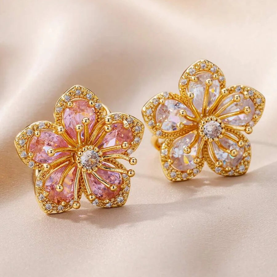Elegante vergulde bloemenring met roze zirkonia