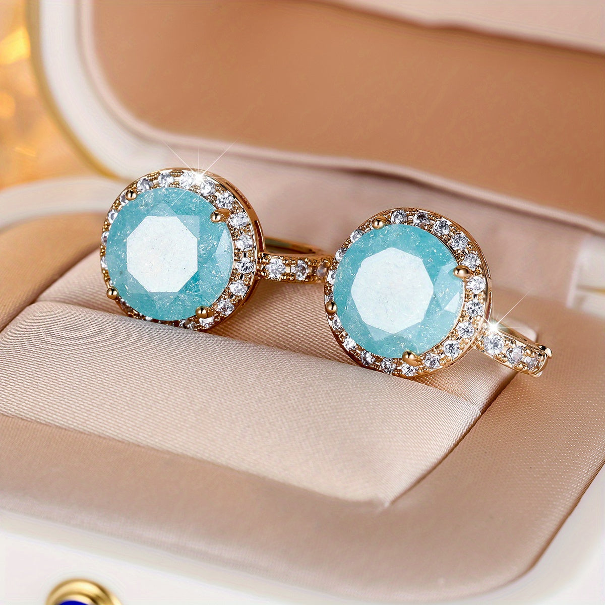 Elegante clip oorbellen met rond geslepen ijsbloem en aquablauwe steen