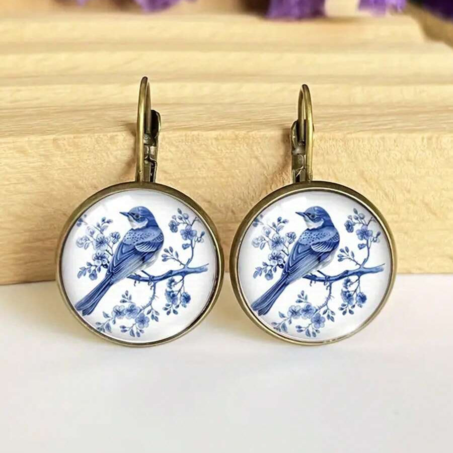 Retro ronde haakoorbellen in de vorm van een blauwe vogel