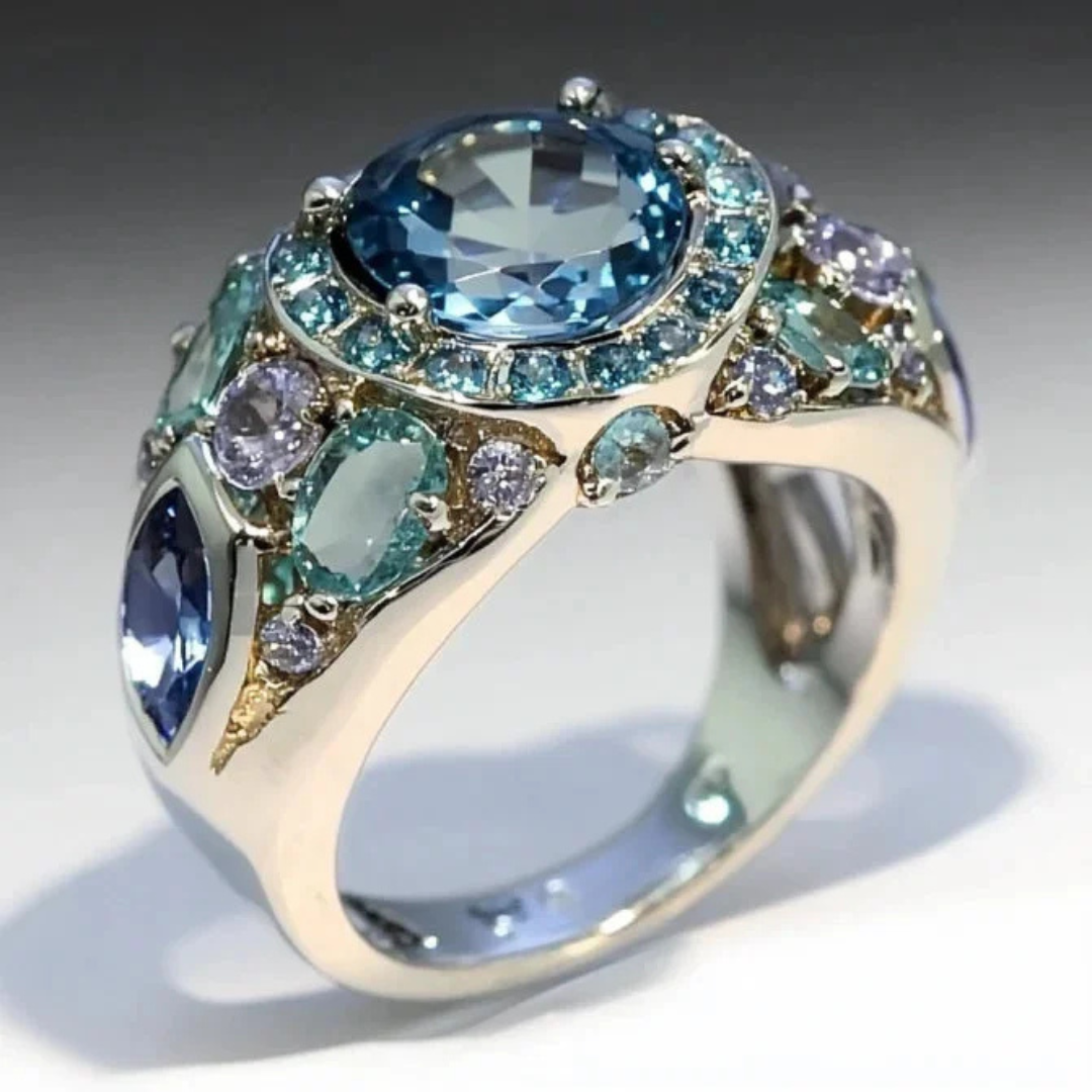 Stijlvolle geometrische ring met meerdere blauwe kristallen