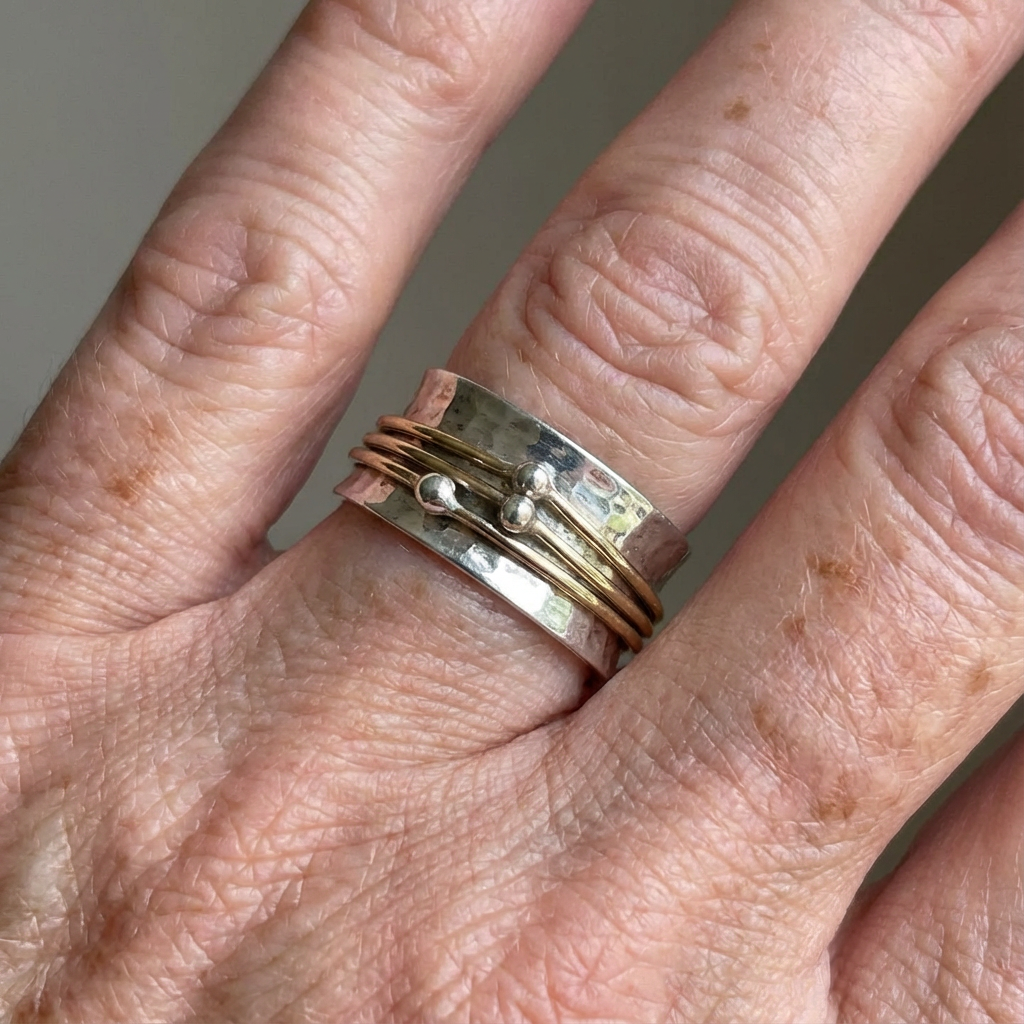 Vintage zilverkleurige comfort spinner ring met goudkleurige lagen