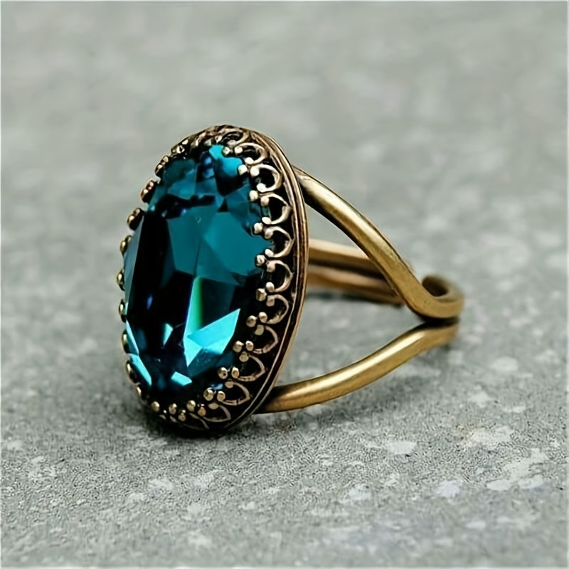 Elegante vergulde ring met ovale blauwe steen