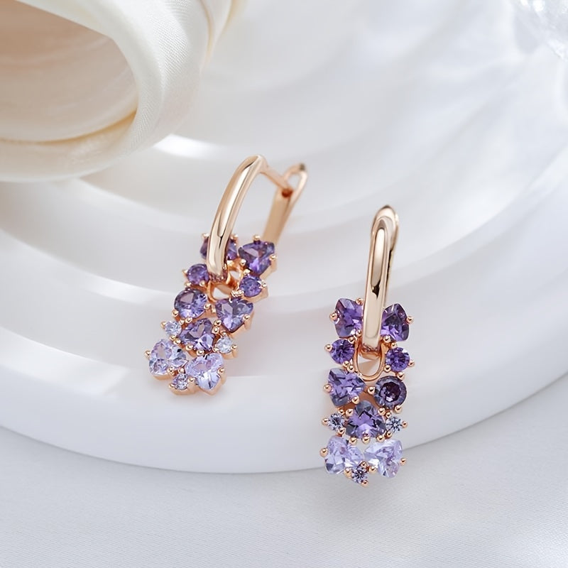Elegante vergulde oorhangers met paarse zirkonia