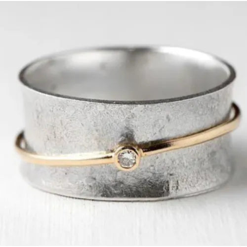 Vintage zilverkleurige open ringband met goudkleurige bol