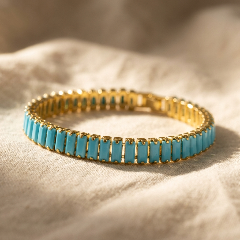Goudkleurige rechthoekige armband met turkoois inleg