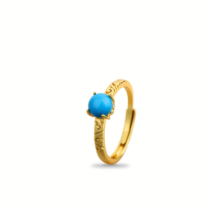 Elegante goudkleurige ring met gladde turkooizen edelsteen