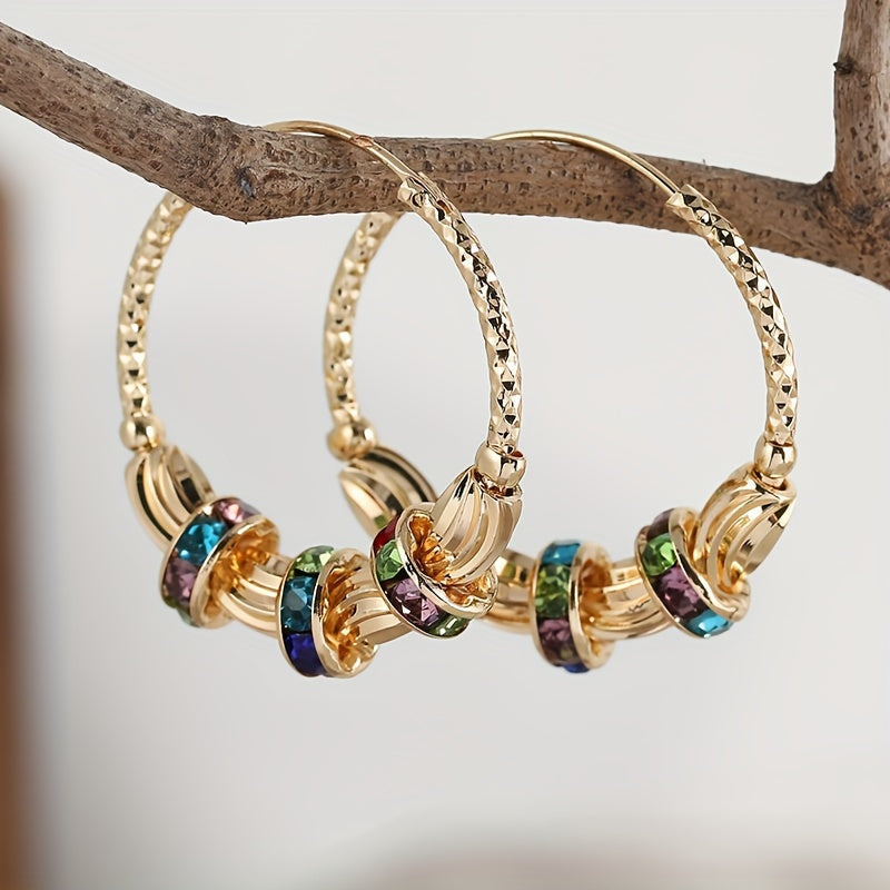 Elegante goudkleurige oorbellen met regenboog zirkonia steen