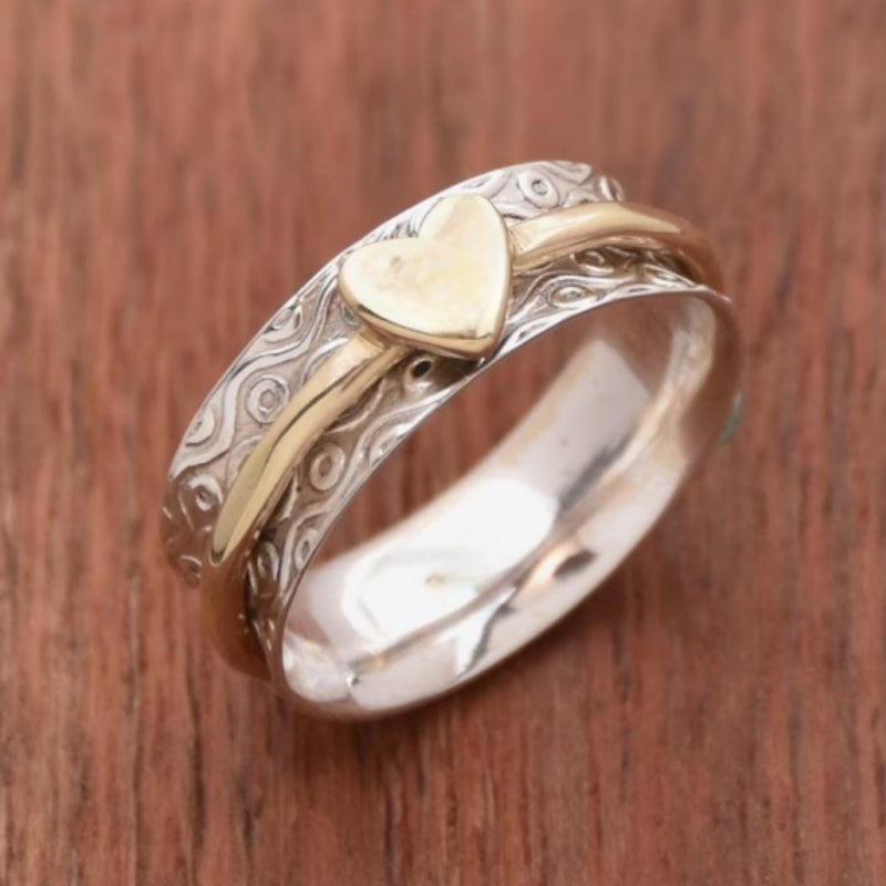Vintage tweekleurige spinner ring met hartpatroon