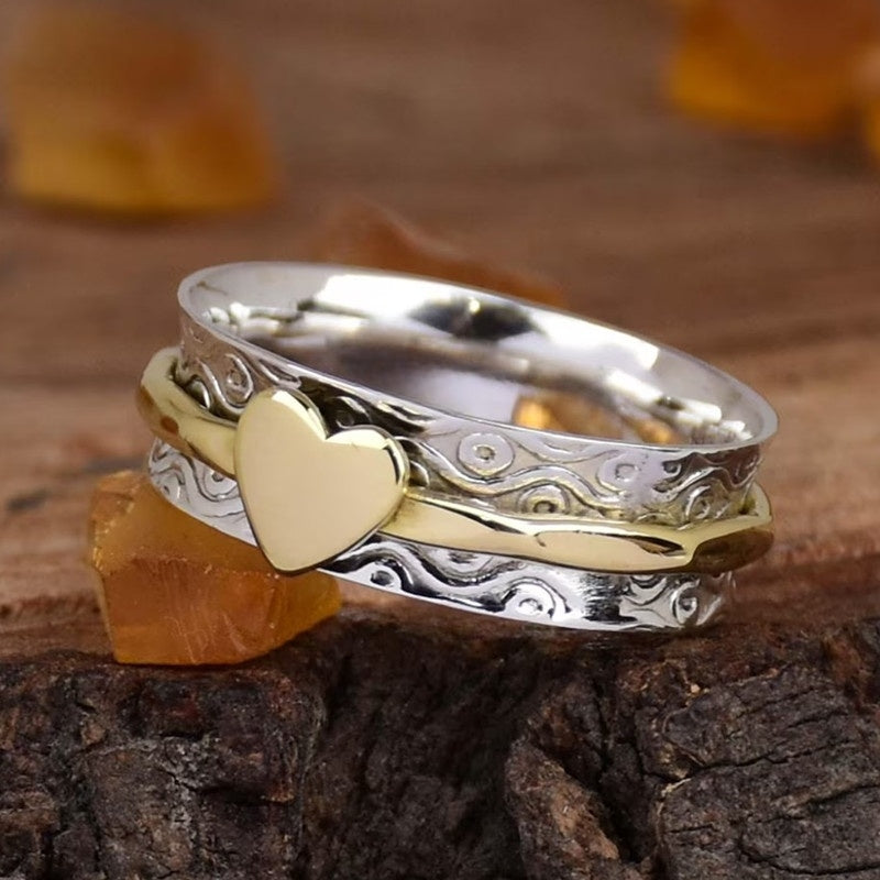 Vintage tweekleurige spinner ring met hartpatroon