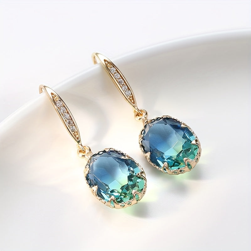Elegante vintage geïnspireerde oorhangers met ovaal groen kristal