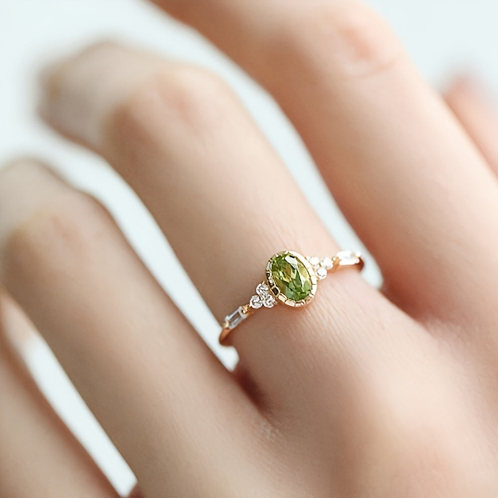 Vintage vergulde ring met ovale groene zirkonia en diamantaccent