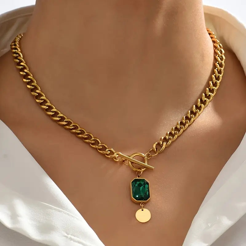 Chunky schakelketting met smaragd hanger | goudkleurig