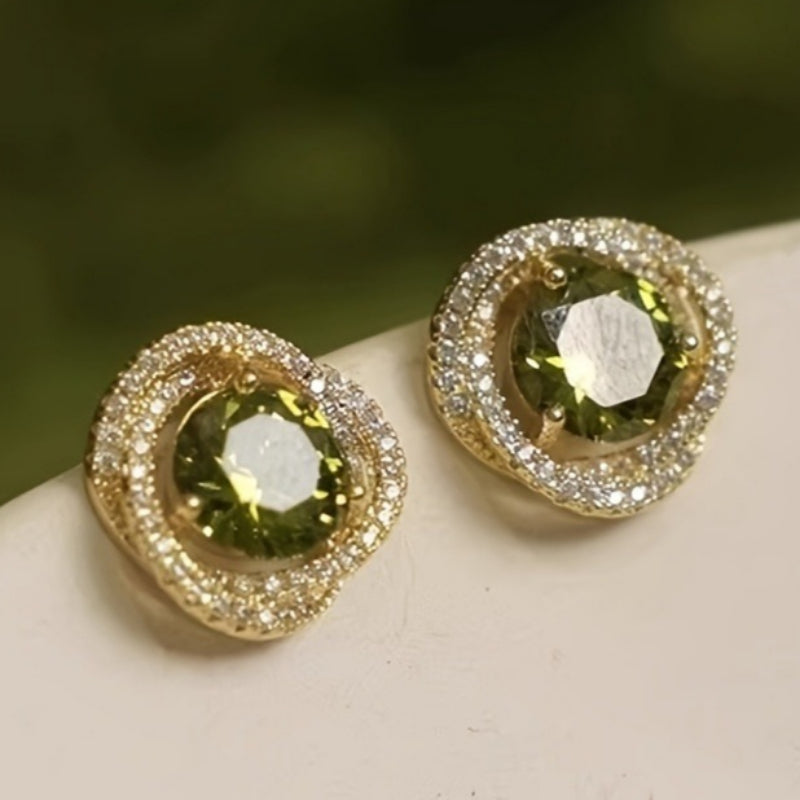 Vintage bloemoorknopjes met groene zirkonia en dubbele halo
