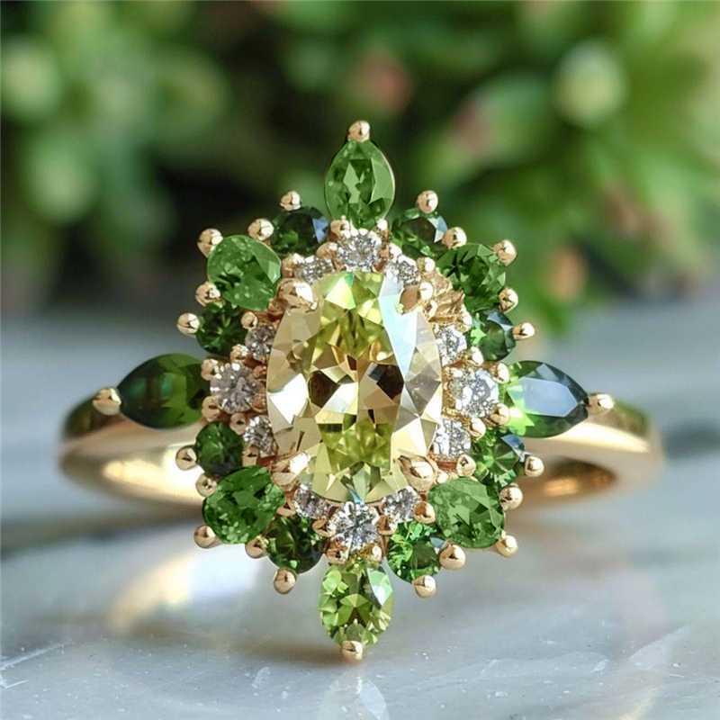 Elegante vintage tweekleurige ring met groene zirkonia