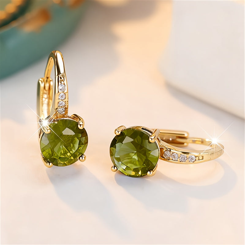 Vintage bohemien oorbellen met groen zirkonia in goudkleurige klauwzetting