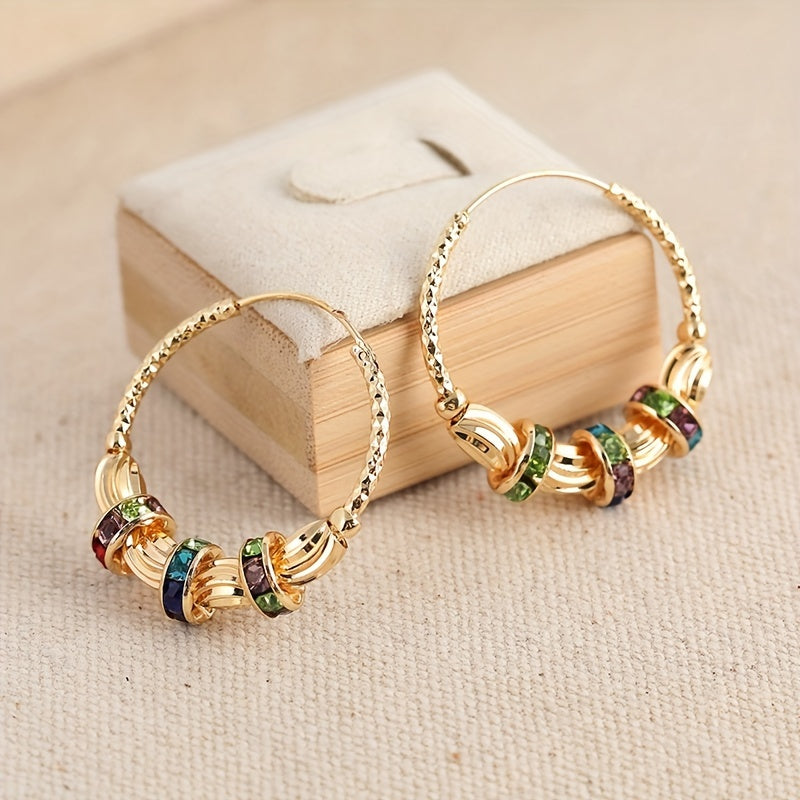 Elegante goudkleurige oorbellen met regenboog zirkonia steen