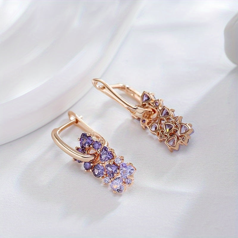 Elegante vergulde oorringen met paarse zirkonia