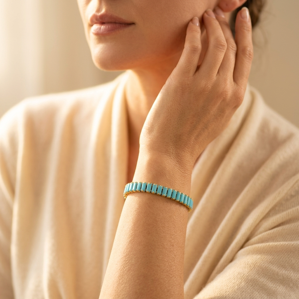 Goudkleurige rechthoekige armband met turkoois inleg