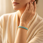 Goudkleurige rechthoekige armband met turkoois inleg
