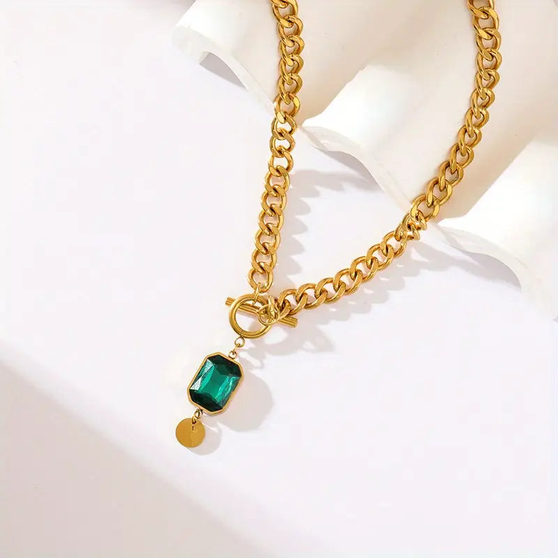 Chunky schakelketting met smaragd hanger | goudkleurig