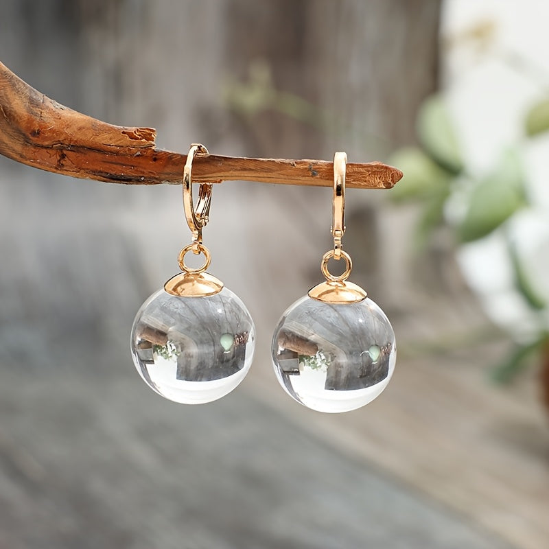 Minimalistische oorhangers met ronde glazen hanger