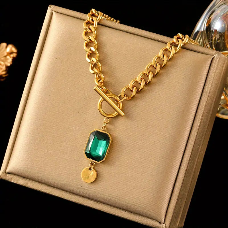 Chunky schakelketting met smaragd hanger | goudkleurig