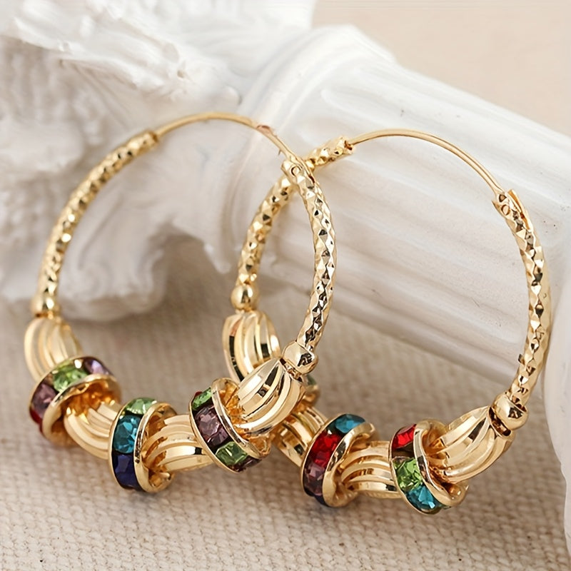 Elegante goudkleurige oorbellen met regenboog zirkonia steen