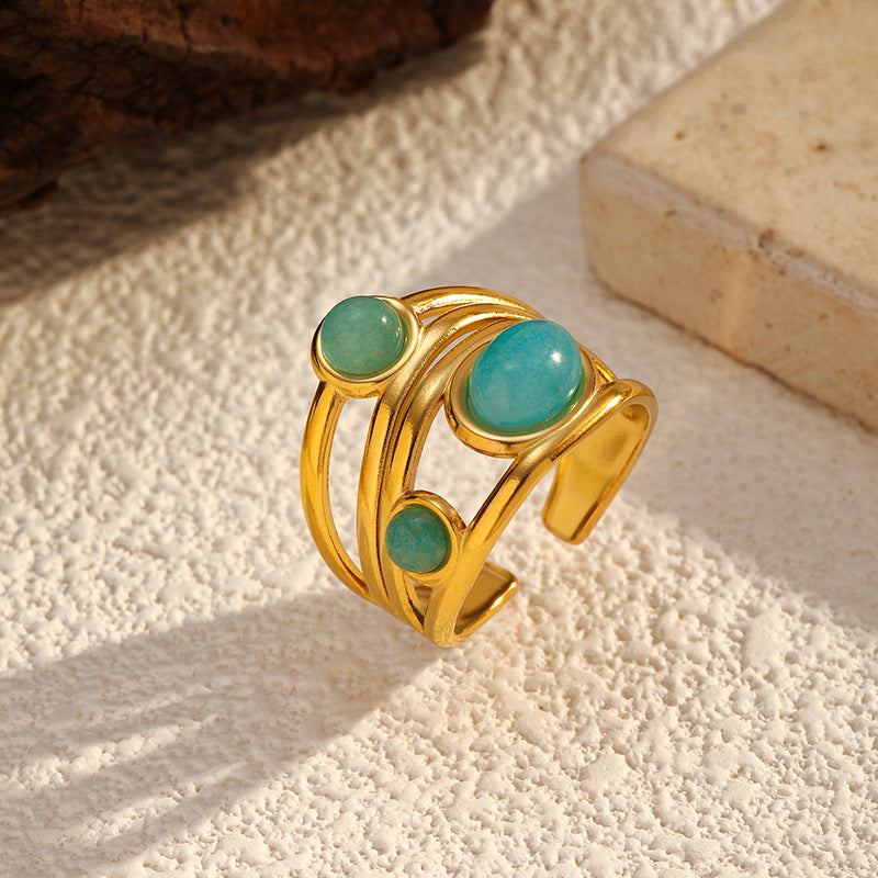 Goudkleurige draad statement ring met dubbele turkoois steen