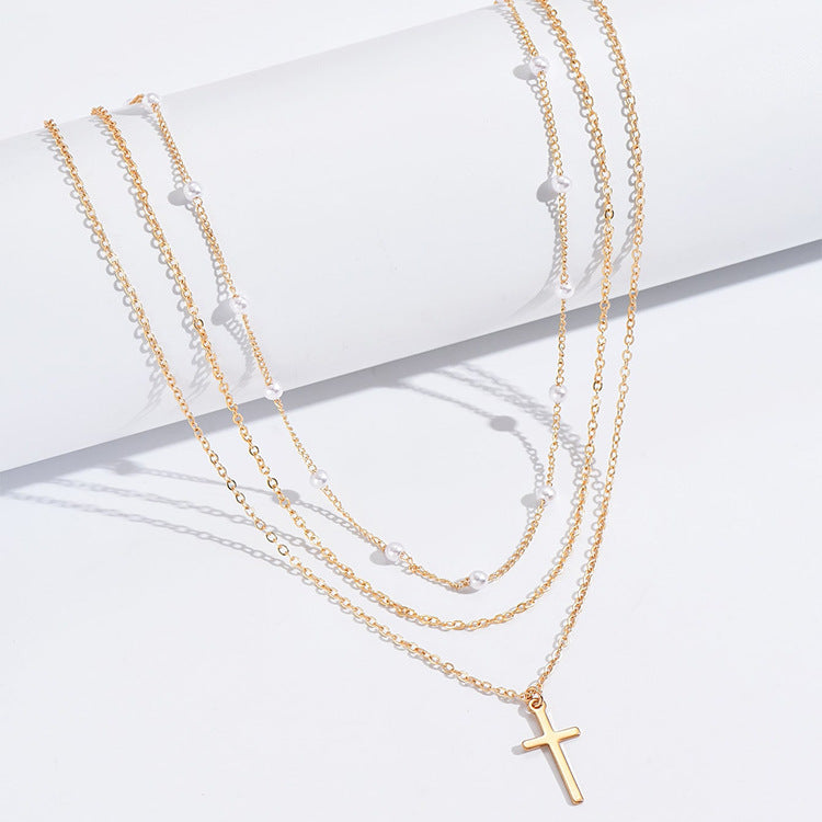 Drielaagse parelketting met kruis