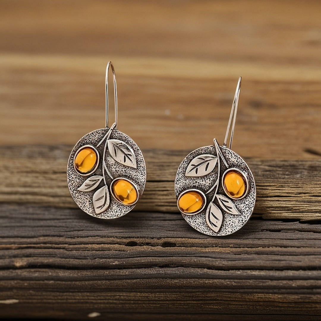 Vintage schijfoorbellen met natuurdesign in amberkleurig blad
