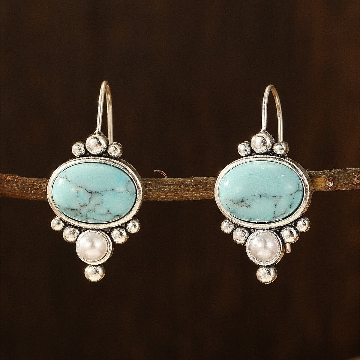 Vintage verzilverde oorhangers met turkoois en parel