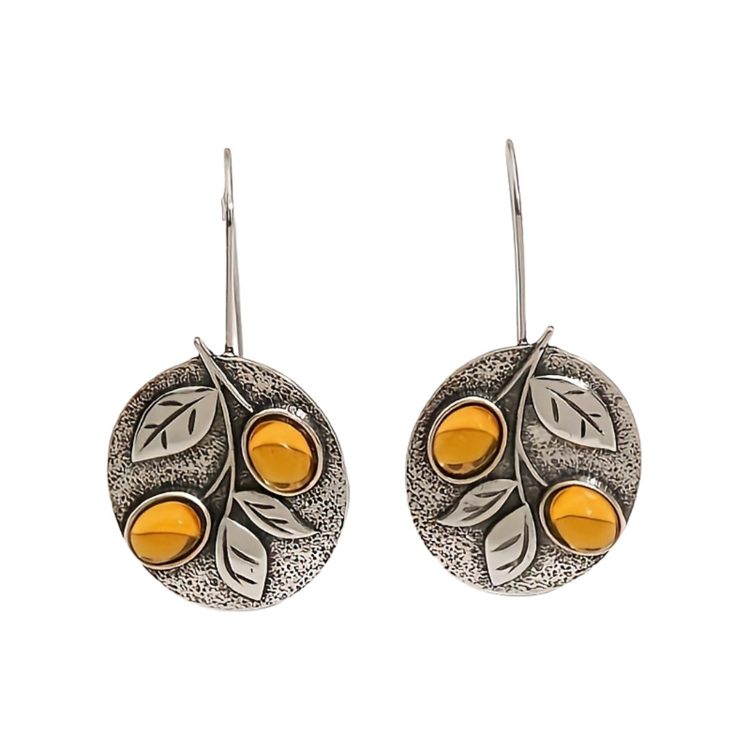 Vintage schijfoorbellen met natuurdesign in amberkleurig blad