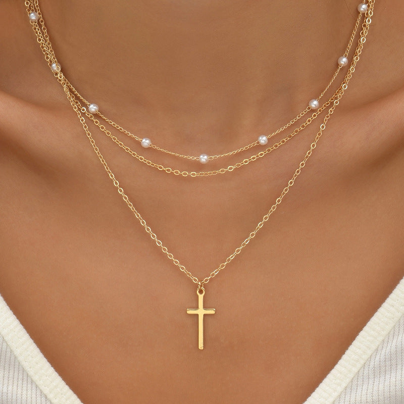Drielaagse parelketting met kruis