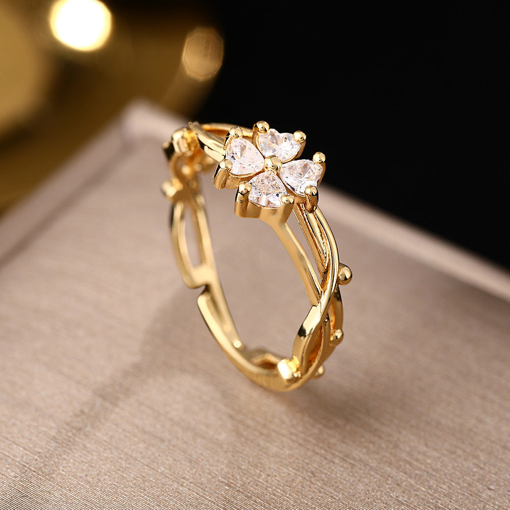 Elegante verstelbare open ring met zirkonia bloem en blad