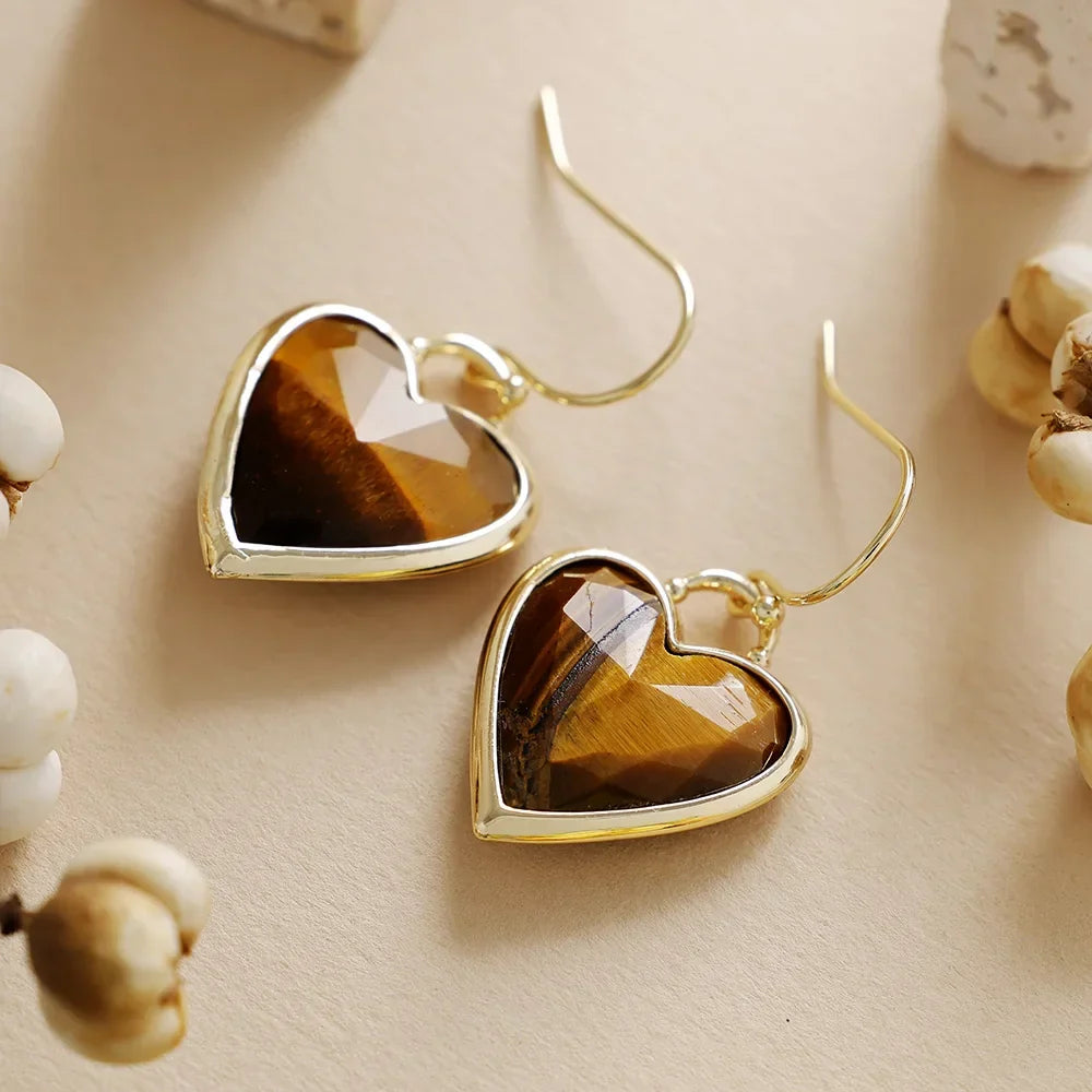 Elegante vergulde oorbellen met liefdesband