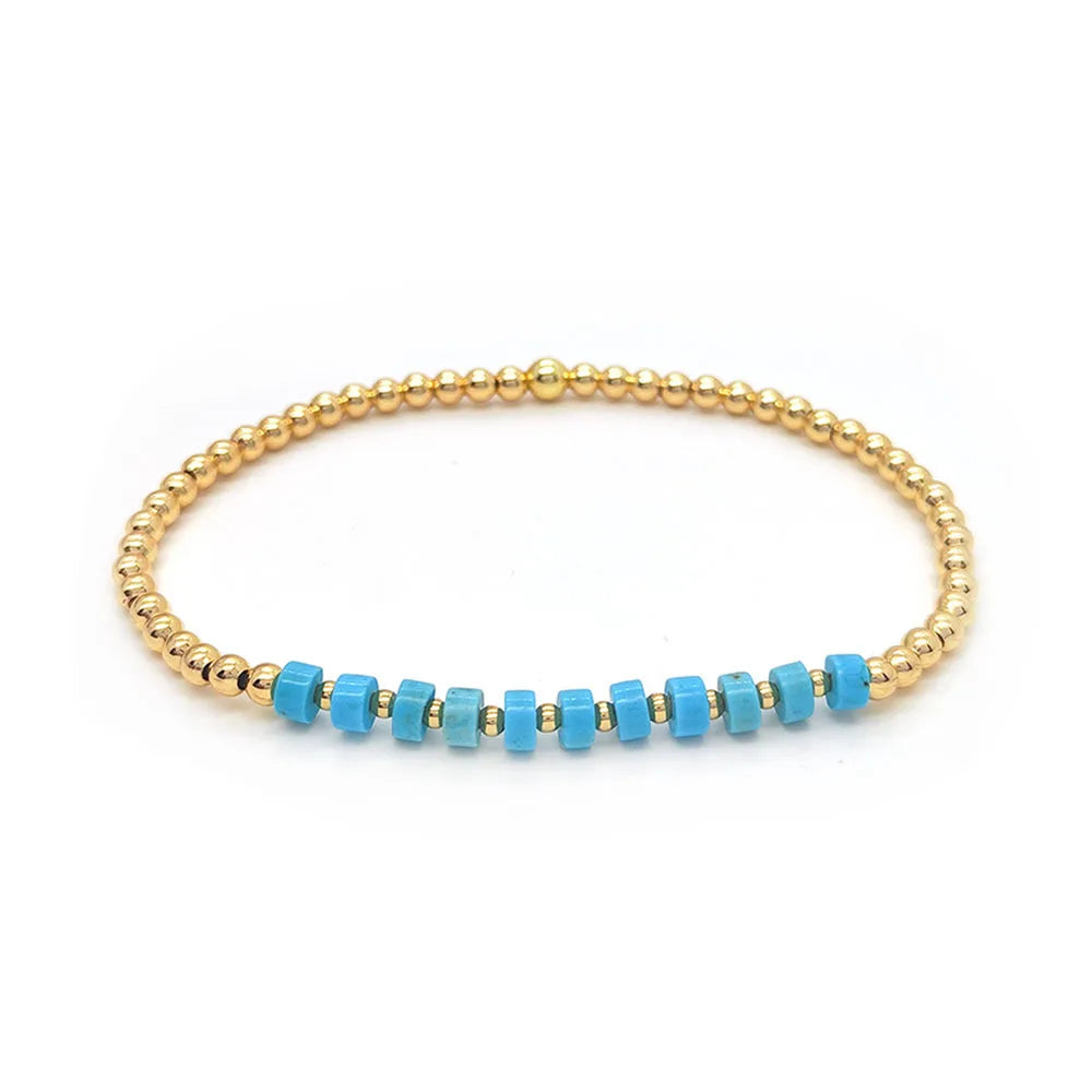 Vintage turkooizen kralenarmband met kruisbedel