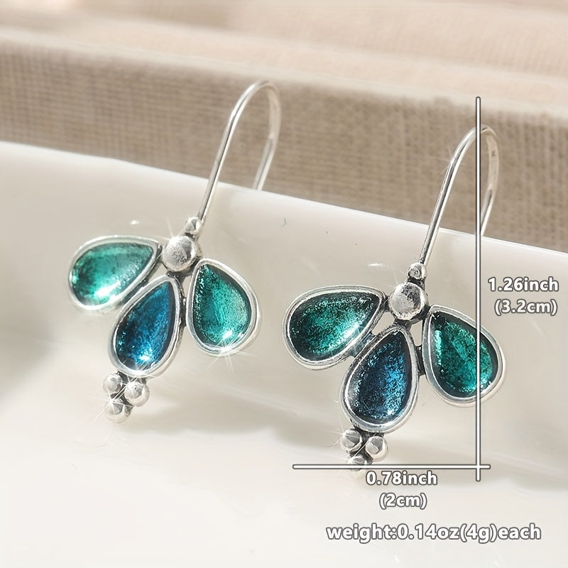 Vintage verzilverde ambachtelijke oorbellen met blauw emaille bloemmotief