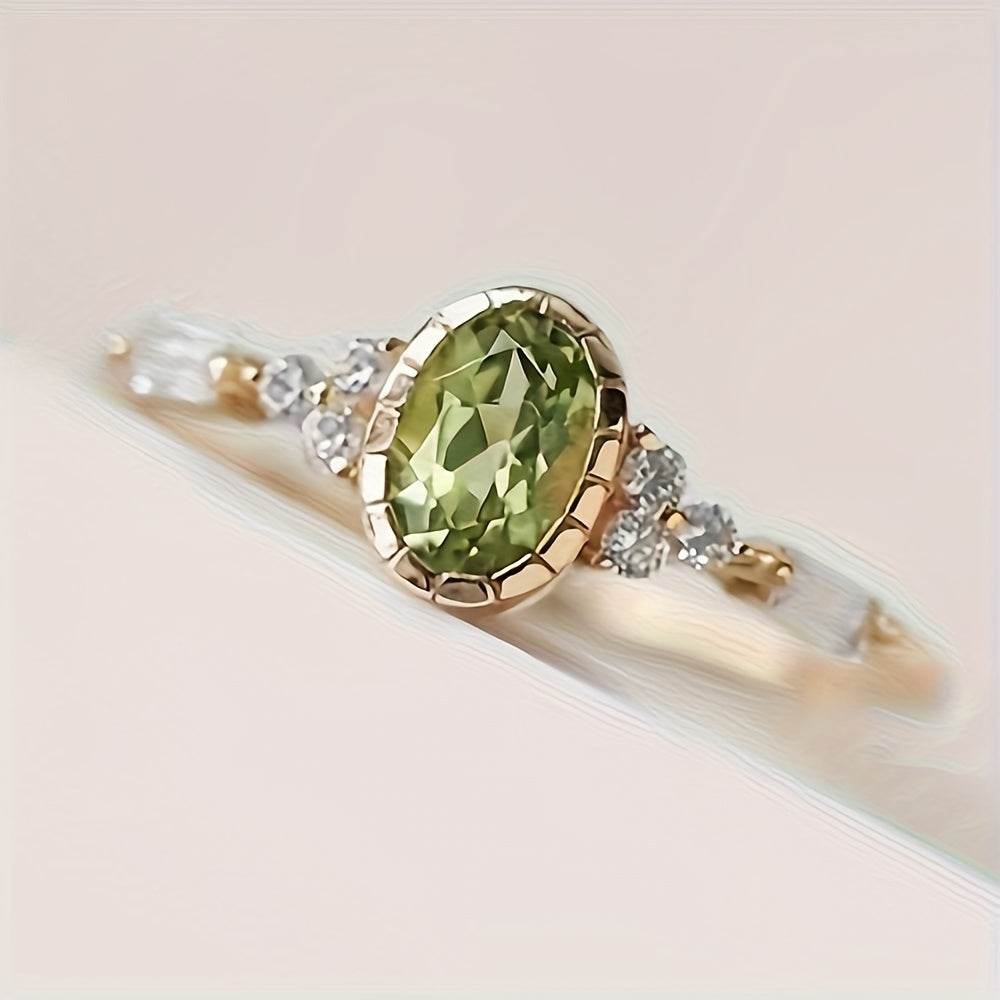 Vintage vergulde ring met ovale groene zirkonia en diamantaccent