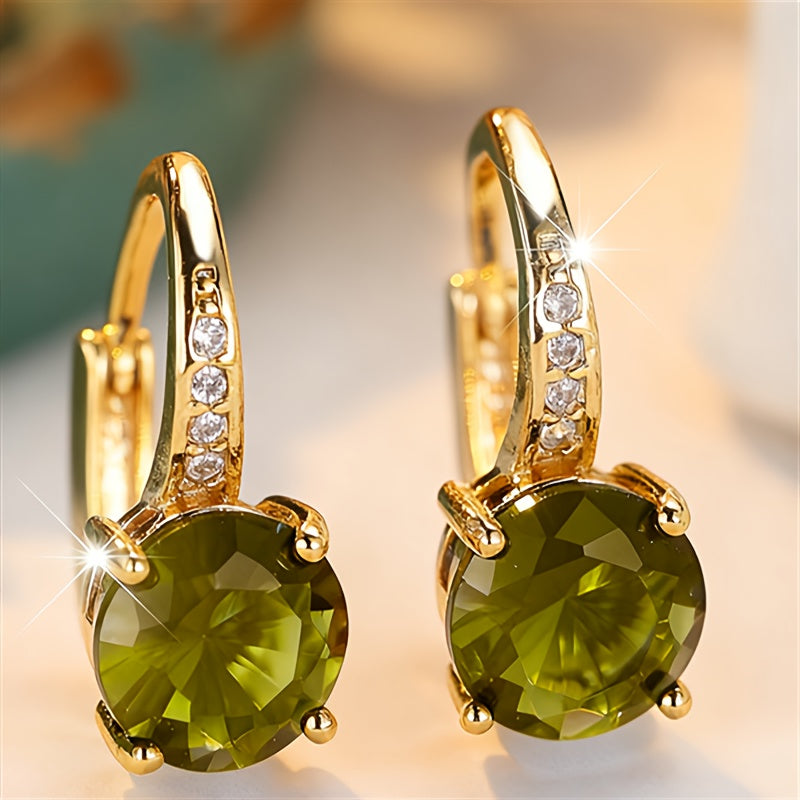 Vintage bohemien oorbellen met groen zirkonia in goudkleurige klauwzetting