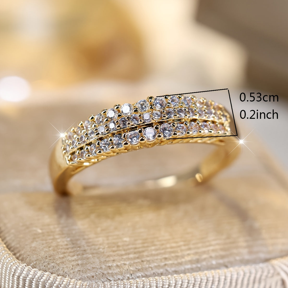 Elegante vergulde ring met drie rijen sprankelende zirkonia